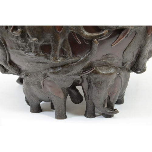 11 - Genryusai Seiya, a Japanese bronze jardiniere, Meiji, circa 1900, modelled in relief with elephants,... 