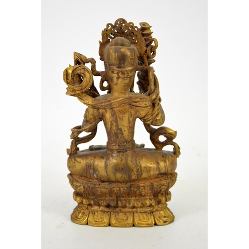 14 - A Chinese gilt jade and bronze figure of a Buddhist deity, modelled with headdress, axe and sceptre,... 