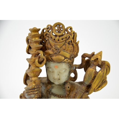 14 - A Chinese gilt jade and bronze figure of a Buddhist deity, modelled with headdress, axe and sceptre,... 