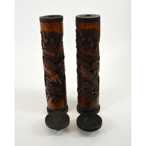 18 - A pair of Chinese carved bamboo and reticulated joss stick holders, relief carved in the round with ... 