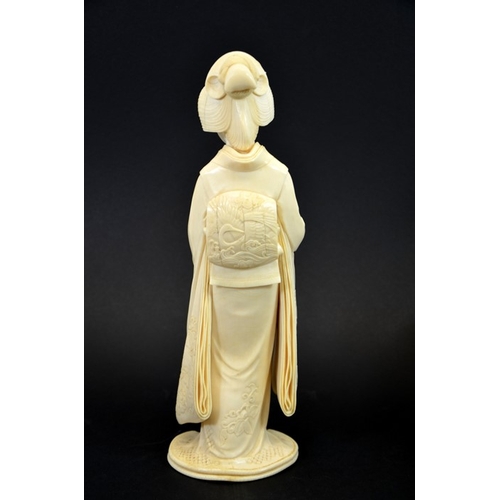 22 - λ A 19th century Japanese carved ivory okimono of a Geisha, Meiji, modelled with a stringed instrume... 