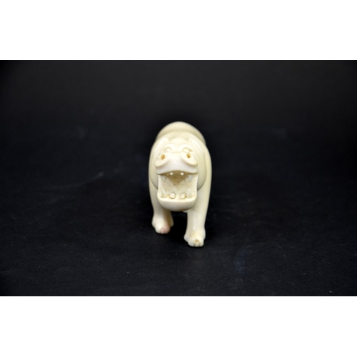 23 - λ A 19th century African carved ivory figure of a hippo, modelled with mouth open, 11.5cm long