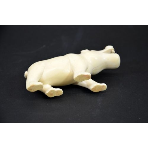 23 - λ A 19th century African carved ivory figure of a hippo, modelled with mouth open, 11.5cm long