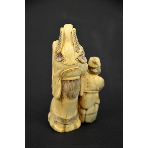 29 - λ A 19th century Japanese carved ivory okimono, modelled as three grotesque figures, holding lantern... 