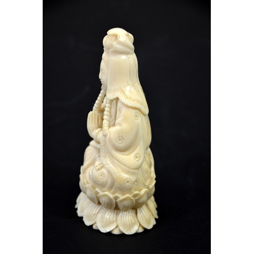 30 - λ A Chinese carved ivory figure of Guanyin, circa 1900, seated Buddhist pose, on lotus leaf, 13cm hi... 