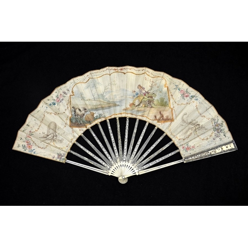 39 - λ A late 18th century Dutch ivory fan with carved, pierced and silvered guards and sticks with minut... 