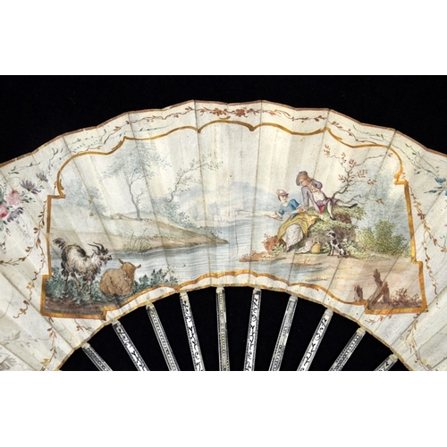 39 - λ A late 18th century Dutch ivory fan with carved, pierced and silvered guards and sticks with minut... 