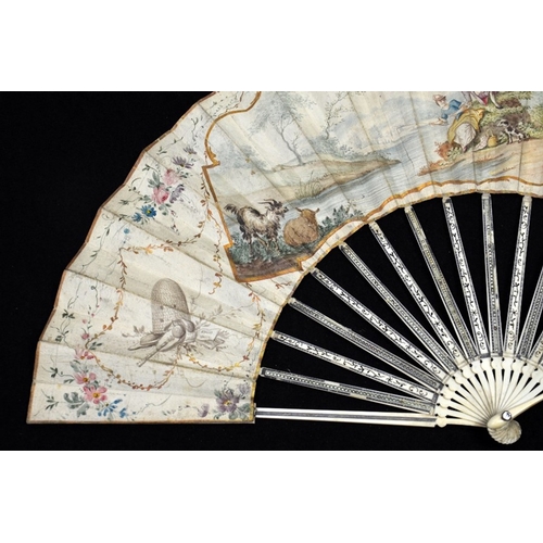 39 - λ A late 18th century Dutch ivory fan with carved, pierced and silvered guards and sticks with minut... 