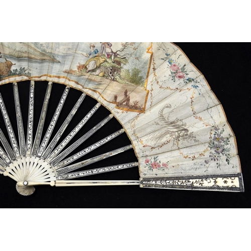 39 - λ A late 18th century Dutch ivory fan with carved, pierced and silvered guards and sticks with minut... 