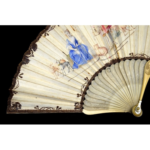 42 - λ An early 18th century ivory fan, with carved ivory sticks and guards, the guards carved with figur... 