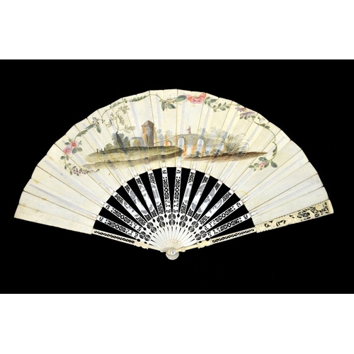 44 - λ An 18th century ivory fan, with elaborately carved and pierced Chinoiserie guards and sticks, the ... 