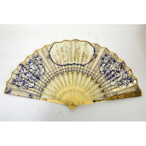 49 - A 19th century bone  and printed fan, reticulated sticks with silver and gilt overlay, a coloured pa... 