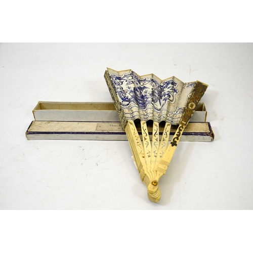 49 - A 19th century bone  and printed fan, reticulated sticks with silver and gilt overlay, a coloured pa... 