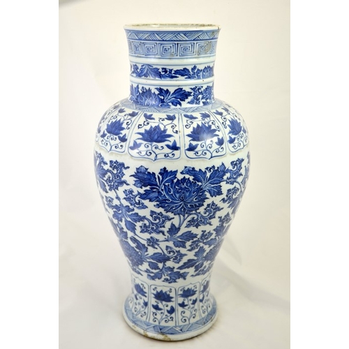 5 - A large Chinese Kangxi blue and white vase, inverse baluster form, decorated with lotus scrolls in t... 