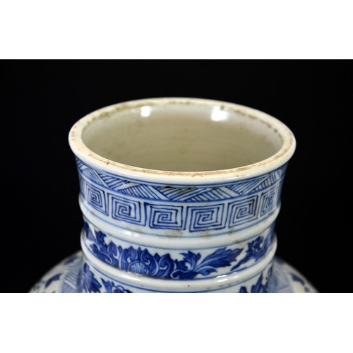 5 - A large Chinese Kangxi blue and white vase, inverse baluster form, decorated with lotus scrolls in t... 