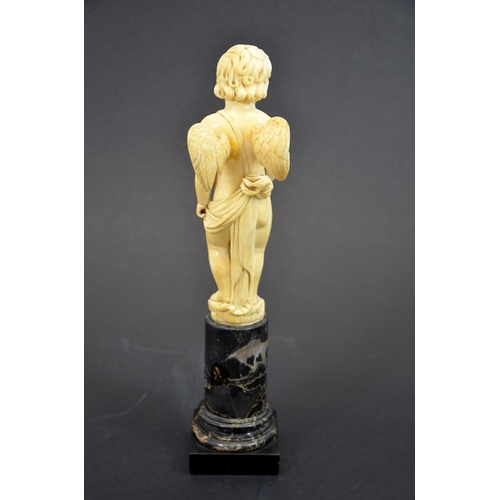 51 - A 19th century Dieppe carved ivory figure of Cupid, on marble plinth, 28cm high