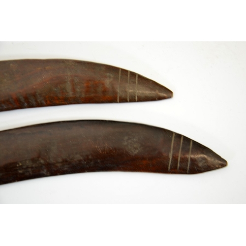 53 - Two 19th century Australian Aboriginal boomerangs, carved wood, each with three lines engraved to on... 