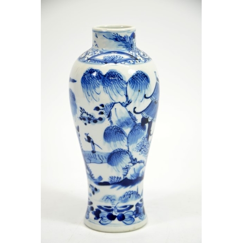 6 - A Chinese blue and white vase, Kangxi mark and probably of the period, painted in the round with tem... 