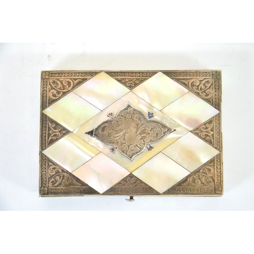 76 - A Victorian mother of pearl and silver card case, chased cartouche and corners, opening to reveal a ... 