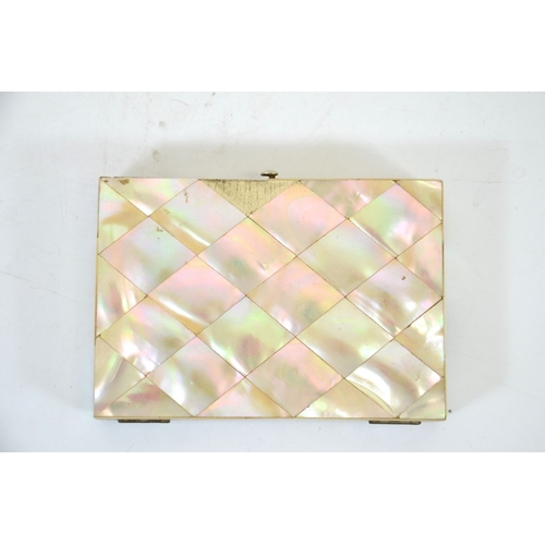 76 - A Victorian mother of pearl and silver card case, chased cartouche and corners, opening to reveal a ... 