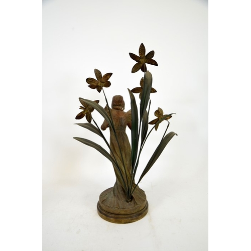 82 - A pair of French Art Nouveau bronzed and painted figures, La Violette and L'Orchidee, modelled as fe... 