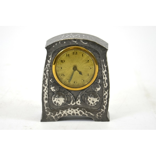 93 - Archibald Knox (attributed) for Liberty and Co., a Tudric pewter clock, planished and relief decorat... 