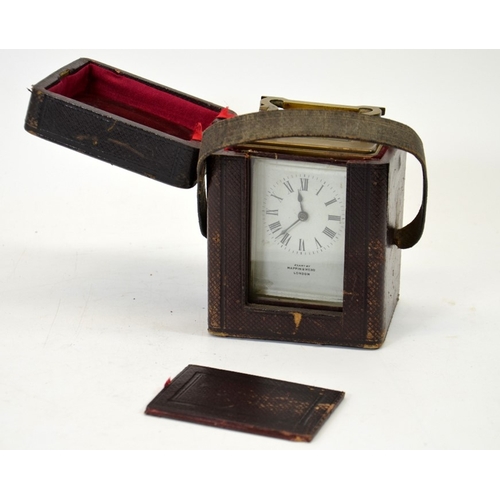 95 - A Mappin and Webb gilt brass carriage timepiece, in leather case, with key, 14.5cm high to handle