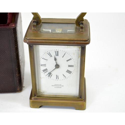 95 - A Mappin and Webb gilt brass carriage timepiece, in leather case, with key, 14.5cm high to handle