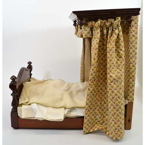 107 - A Victorian mahogany dolls half tester bed, with fabric upholstery, 41cm high