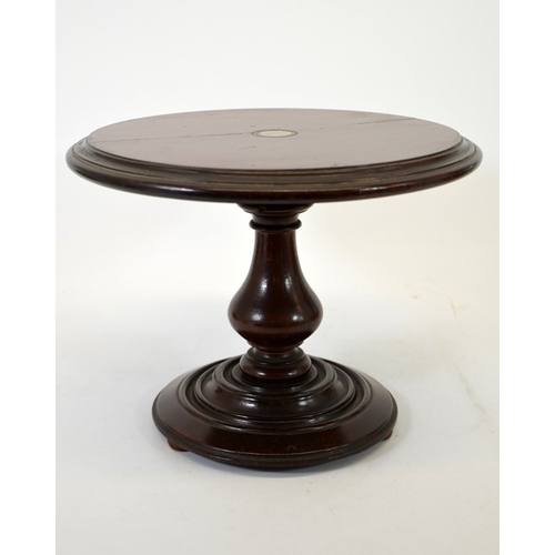 108 - A miniature Victorian mahogany tilt top breakfast table, the circular top set with pewter rounder, o... 