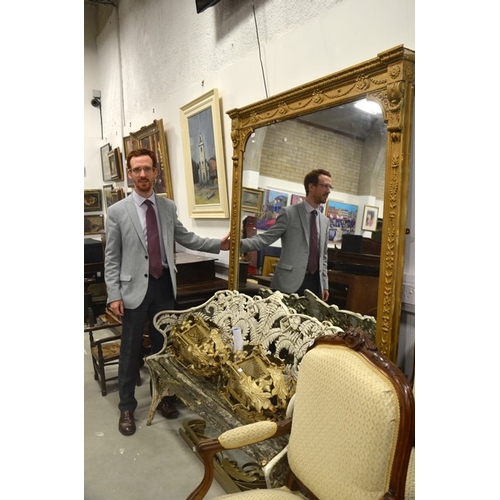 113 - A mid 19th century gilt framed overmantle mirror, with acanthus leaf decoration and floral swags. 20... 