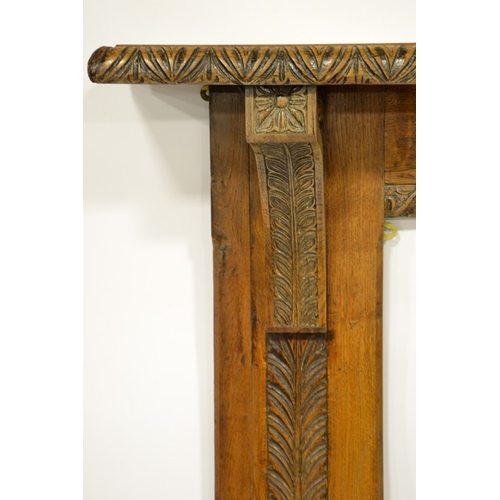 115 - A Victorian oak fire surround, carved with foliate borders and floral motifs, 114cm high, 150cm long