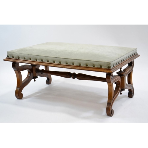 117 - A large Regency walnut footstool, in the manner of Thomas Hope, supported on lyre shaped ends united... 