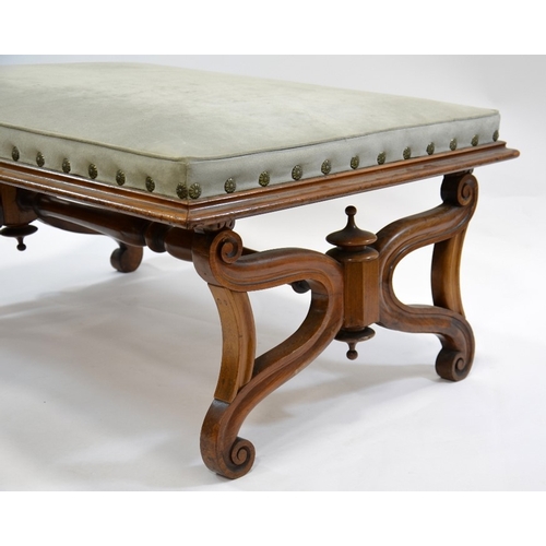 117 - A large Regency walnut footstool, in the manner of Thomas Hope, supported on lyre shaped ends united... 