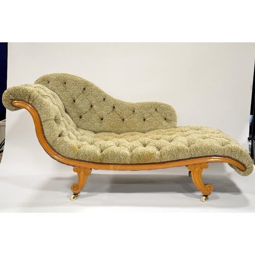 119 - A Biedermeier satinwood chaise longue, circa 1840, S shaped design on cornucopia horn feet and brass... 