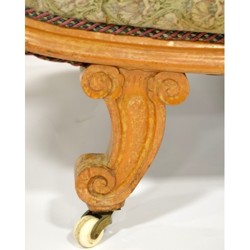 119 - A Biedermeier satinwood chaise longue, circa 1840, S shaped design on cornucopia horn feet and brass... 