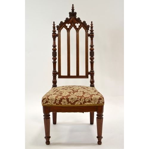 125 - A Gothic Revival mahogany chair, circa 1840, three arched back with trefoil cartouches and leaf moul... 