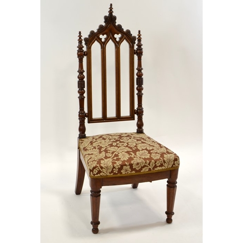 125 - A Gothic Revival mahogany chair, circa 1840, three arched back with trefoil cartouches and leaf moul... 