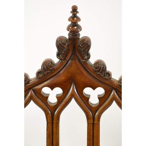 125 - A Gothic Revival mahogany chair, circa 1840, three arched back with trefoil cartouches and leaf moul... 