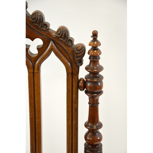 125 - A Gothic Revival mahogany chair, circa 1840, three arched back with trefoil cartouches and leaf moul... 