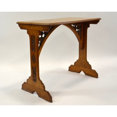 131 - A W N Pugin (attributed), a Gothic Revival oak side table, the two trestle supports carved with ivy ... 