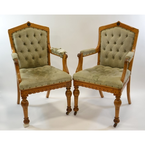 138 - Charles Bevan (attributed), a pair of Gothic Revival oak open armchairs, each chair inlaid with ebon... 