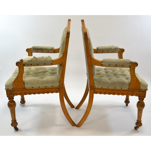 138 - Charles Bevan (attributed), a pair of Gothic Revival oak open armchairs, each chair inlaid with ebon... 