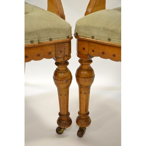 138 - Charles Bevan (attributed), a pair of Gothic Revival oak open armchairs, each chair inlaid with ebon... 