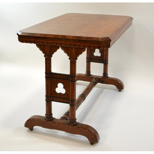 139 - Charles Bevan (attributed), a Reformed Gothic revival pine table, the figured rectangular top with d... 