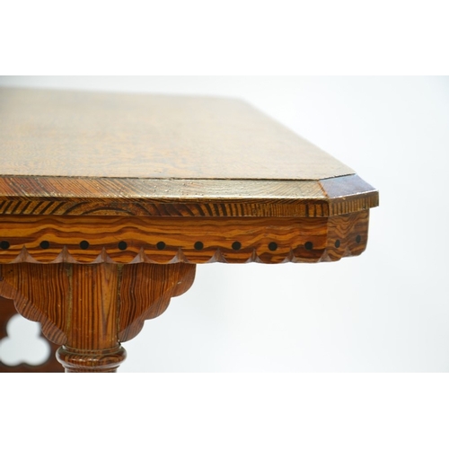 139 - Charles Bevan (attributed), a Reformed Gothic revival pine table, the figured rectangular top with d... 