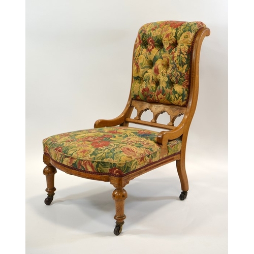 140 - Charles Bevan (attributed), a Gothic Revival oak easy chair, the curved boat back upholstered below ... 