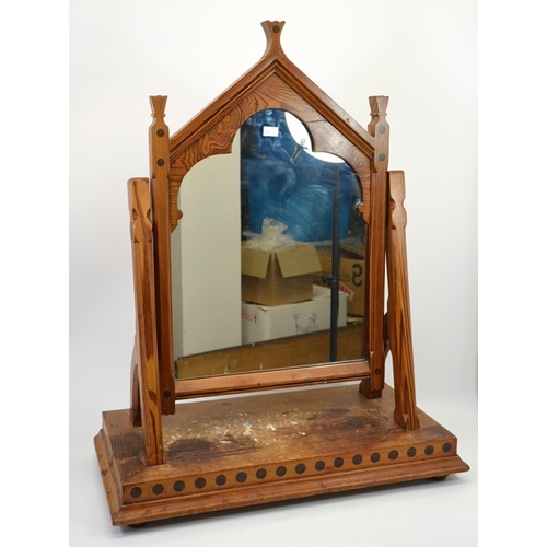 141 - Charles Bevan (attributed), a Gothic Revival pine swing toilet mirror, the triangular arched frame w... 