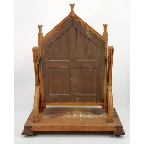 141 - Charles Bevan (attributed), a Gothic Revival pine swing toilet mirror, the triangular arched frame w... 