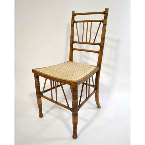 143 - Liberty and Co., a Thebes chair, circa 1880, ash and elm construction with upholstered seat, Liberty... 